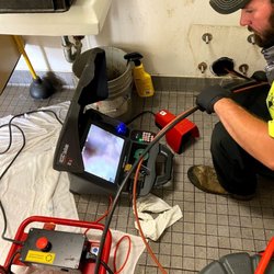 Savy & Sons - Performing sewer line inspection.