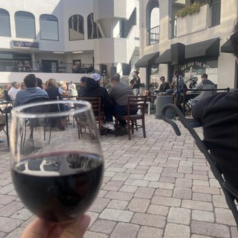Dracula's Legacy Wine Bar - Jack poured and recommended us some delicious wine to enjoy with an amazing live band for our entertainment!! - Wine Bars Near Me - St. Petersburg, Florida