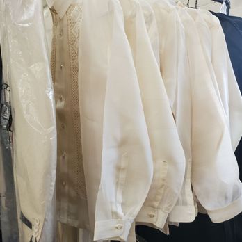 Weddings and Dreams - A rack displaying a set of barong tagalogs. - Bridal Near Me - Fremont, California Weddings and Dreams - A rack displaying a set of barong tagalogs. - Bridal Near Me - Fremont, California