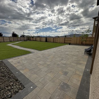 Nevada Silver Construction - a backyard with a patio and grass - Landscaping Near Me Nevada Silver Construction - a backyard with a patio and grass - Landscaping Near Me