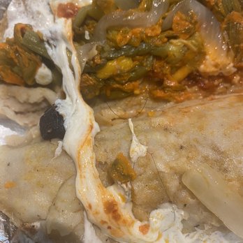 El rinconcito Chilango taqueria - a close up of a tasty looking burrito - Mexican Near Me - Charlotte, North Carolina El rinconcito Chilango taqueria - a close up of a tasty looking burrito - Mexican Near Me - Charlotte, North Carolina