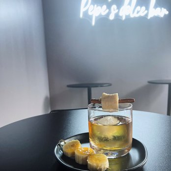 Pepe’s Dolce Bar - a glass of drink and a slice of banana - Desserts Near Me - Worcester, Massachusetts