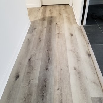 Texas Best Floors - a hardwood floor in a hallway - Flooring Near Me - Arlington, Texas Texas Best Floors - a hardwood floor in a hallway - Flooring Near Me - Arlington, Texas