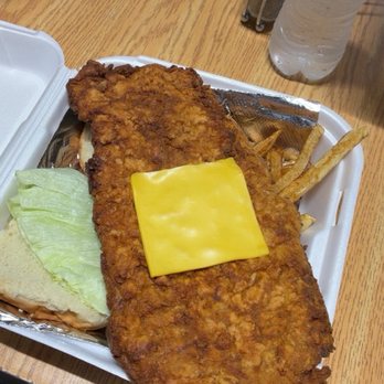 Westons Garage Bar and Grill - Tenderloin with American cheese, toppings and fries - Chicken Wings Near Me - St Joseph, Missouri Westons Garage Bar and Grill - Tenderloin with American cheese, toppings and fries - Chicken Wings Near Me - St Joseph, Missouri