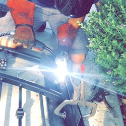 Castle Garage Doors - Welding in the field.