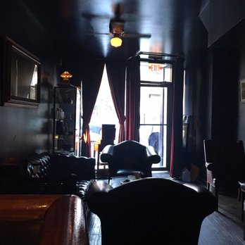 Blew Smoke - a dark living room with black walls - Cigar Bars Near Me - Brooklyn, New York