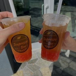 Teapresso Bar - Honolulu - Mango Green tea with Strawberry popping boba and a Honey Mango Green Tea with Strawberry popping boba