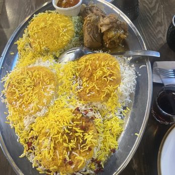 Tah Deeg Persian Cuisine - SPECIAL PLATTER FOR FOUR Four types of rice, barberries, dill and favs bean, saffron and plain basmati with a juicy lamb shank - Persian/Iranian Near Me - Clovis, California Tah Deeg Persian Cuisine - SPECIAL PLATTER FOR FOUR Four types of rice, barberries, dill and favs bean, saffron and plain basmati with a juicy lamb shank - Persian/Iranian Near Me - Clovis, California