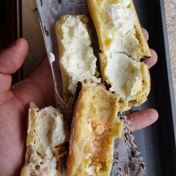 Cascon Cheesecakes - This is the second eclair from same batch, cream overwhip like butter. Very sad. - Bakeries Near Me - Whitestone, New York