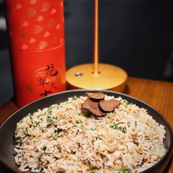 Lunar - a plate of rice and vegetables on a table - Chinese Near Me - New York, New York Lunar - a plate of rice and vegetables on a table - Chinese Near Me - New York, New York