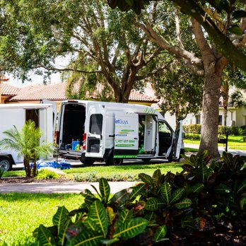 Quiet Guys Lawn Care - a van parked in front of a house - Lawn Services Near Me - St. Cloud, Florida Quiet Guys Lawn Care - a van parked in front of a house - Lawn Services Near Me - St. Cloud, Florida