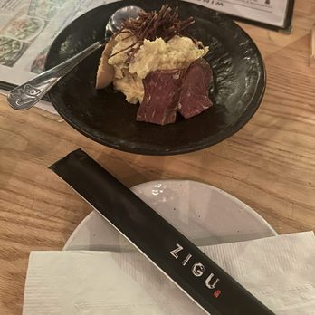 Zigu - Pipikaula potato salad with bacon garnish and shoyu tamago quail eggs - Seafood Near Me - Honolulu, Hawaii