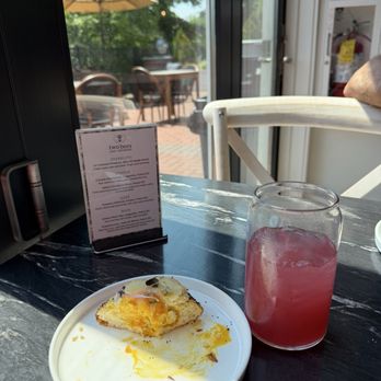 Two Bees Cafe & Patisserie - The last bite of the jammy egg brioche with hibiscus lemonade - Cafes Near Me - Dover, New Hampshire Two Bees Cafe & Patisserie - The last bite of the jammy egg brioche with hibiscus lemonade - Cafes Near Me - Dover, New Hampshire
