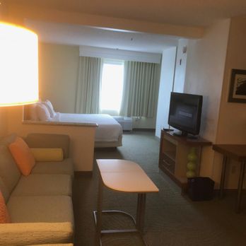 SpringHill Suites - Dulles Airport - Very long and roomy room. It was lighter than this photo with a dining/kitchen thing to the right. - Hotels Near Me - Sterling, Virginia SpringHill Suites - Dulles Airport - Very long and roomy room. It was lighter than this photo with a dining/kitchen thing to the right. - Hotels Near Me - Sterling, Virginia