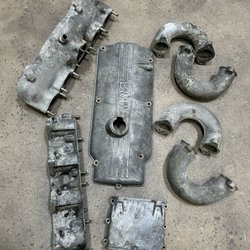 Fortna Equipment - Aluminum BMW engine parts before being cleaned up with glass beads from sand blasting.