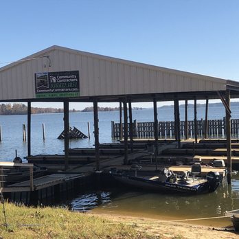 Community Contractors - a dock with boats docked at a marina - Fences & Gates Near Me Community Contractors - a dock with boats docked at a marina - Fences & Gates Near Me