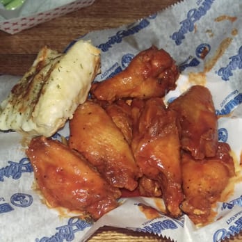 BuffaLouie's - Excellent TNT wings with a side of garlic cheese bread - Chicken Wings Near Me - Bloomington, Indiana
