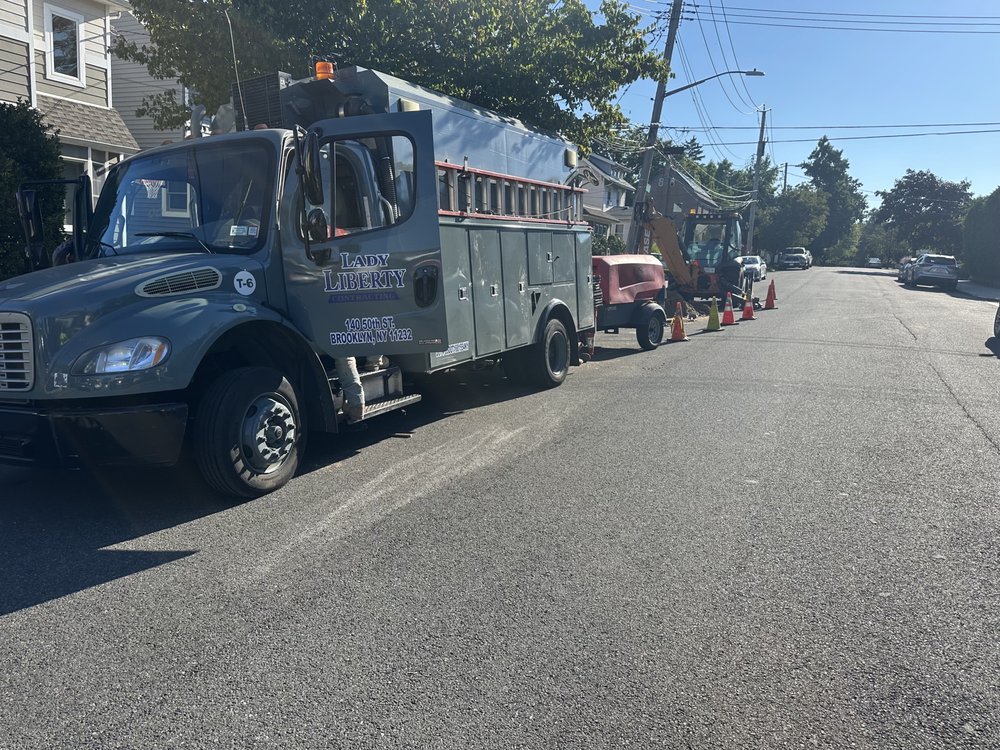 Slide of Lady Liberty Contracting