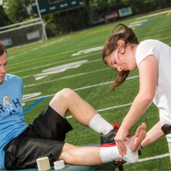 Pivot Physical Therapy - Pivot athletic trainer Katie Cicia working with a student athlete.
