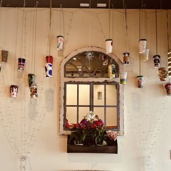Fraise Cafe - Cute wall decor of hanging cups - Creperies Near Me - Fullerton, California