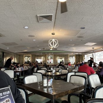 Silver Star Diner - a man holding a menu - Diners Near Me - Norwalk, Connecticut