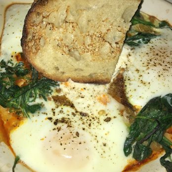 The Smith - Baked eggs with in tomato sauce with spinach, artichokes, and burrata. Soooooo good. - New American Near Me - New York, New York