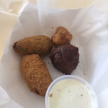 Baudean's - Burnt hush puppie next to stuffed peppers - Seafood Near Me - Theodore, Alabama