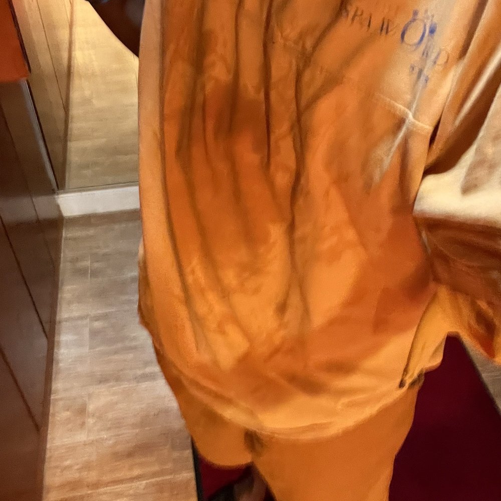 Spa World - Sweaty orange jumpsuit (shirt and shorts) that's provided - Saunas Near Me - Centreville, Virginia Spa World - Sweaty orange jumpsuit (shirt and shorts) that's provided - Saunas Near Me - Centreville, Virginia