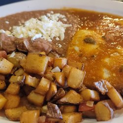 Country Diner Cafe - Huevos Rancheros, beans and potatoes.