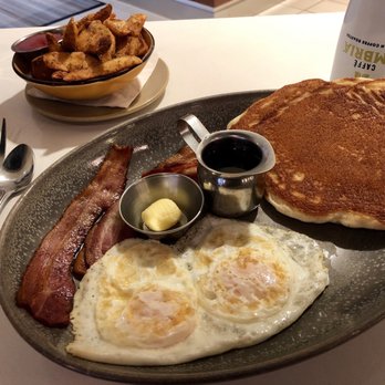OEB Breakfast - Downtown - Threesome with bacon and over medium eggs. Potatoes are extra crispy - Breakfast & Brunch Near Me - Calgary, Alberta
