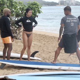 Dan Dan doing his thing and teaching us how to stand up before paddling out into the water.