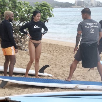 Stoke Drift - Dan Dan doing his thing and teaching us how to stand up before paddling out into the water. - Surf Schools Near Me - Honolulu, Hawaii