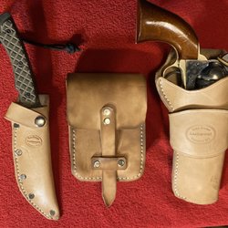 Zack White Leather Co - Leather set for a friend with a .45 Colt clone.  He didn't want a cartridge belt, but a case that would carry 50 .cartridges.