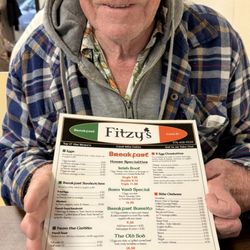 Fitzy's - Customer holding menu