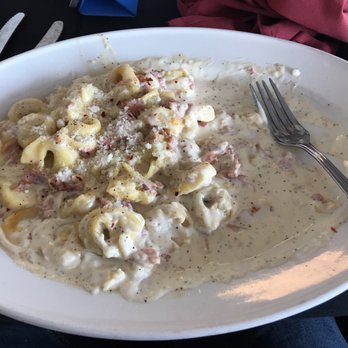 Ricky & Mela - HUGE portions!  After a mighty effort this was as far as I got into my tortellini carbonara.  Delicious! - Italian Near Me - Riverview, Florida