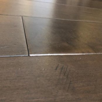 Stone Tree Flooring - Wood planking coming up in corners to the point where you can trip or get a splinter. - General Contractors Near Me