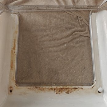 Julia's House Cleaning - One of the drawers in the refrigerator before being cleaned - Home Cleaning Near Me