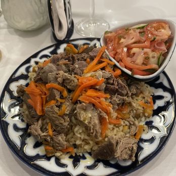 Rus Uz - Alexandria - Plove - Uzbekistan's national dish. Rice mixed with lamb beef carrots chickpeas raisins and spices. A side of tomato and cucumber salad. - Russian Near Me - Alexandria, Virginia Rus Uz - Alexandria - Plove - Uzbekistan's national dish. Rice mixed with lamb beef carrots chickpeas raisins and spices. A side of tomato and cucumber salad. - Russian Near Me - Alexandria, Virginia