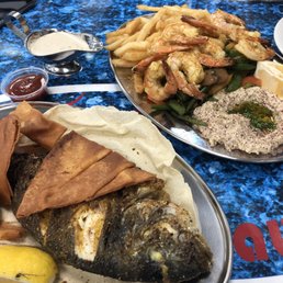 Jumbo shrimp platter (with three sides), and grilled sea bream.