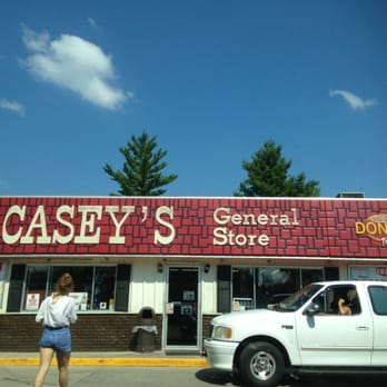 Casey's - a woman standing in front of a store - Pizza Near Me - Delmar, Iowa Casey's - a woman standing in front of a store - Pizza Near Me - Delmar, Iowa