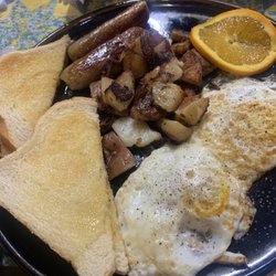 Rare Earth Goods Cafe - 2 eggs over easy, sourdough toast, potatoes and sausage