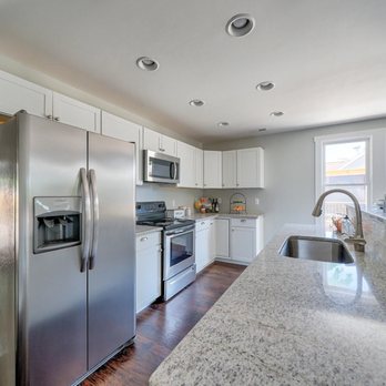 Hutson Construction - a kitchen with stainless steel appliances - General Contractors Near Me - Wilmington, North Carolina Hutson Construction - a kitchen with stainless steel appliances - General Contractors Near Me - Wilmington, North Carolina