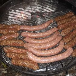 Saravale Meat Market - Grilled Mititei (lamb & beef) sausage on the outside with some Transylvanian pork sausages in the middle on my 22" kettle grill.