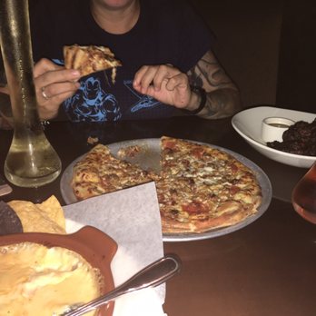Yard House - Chips and queso, pizza, and jerk wings. - New American Near Me - Orlando, Florida