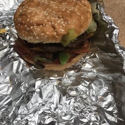 a hamburger wrapped in aluminum foil a hamburger wrapped in aluminum foil