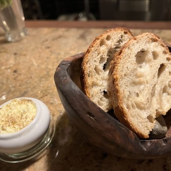 Altura - House made sourdough with porcini salt butter - Italian Near Me - Seattle, Washington Altura - House made sourdough with porcini salt butter - Italian Near Me - Seattle, Washington