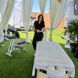 Sincity Massage Therapist - Providing massage services at a private event during EDC weekend.