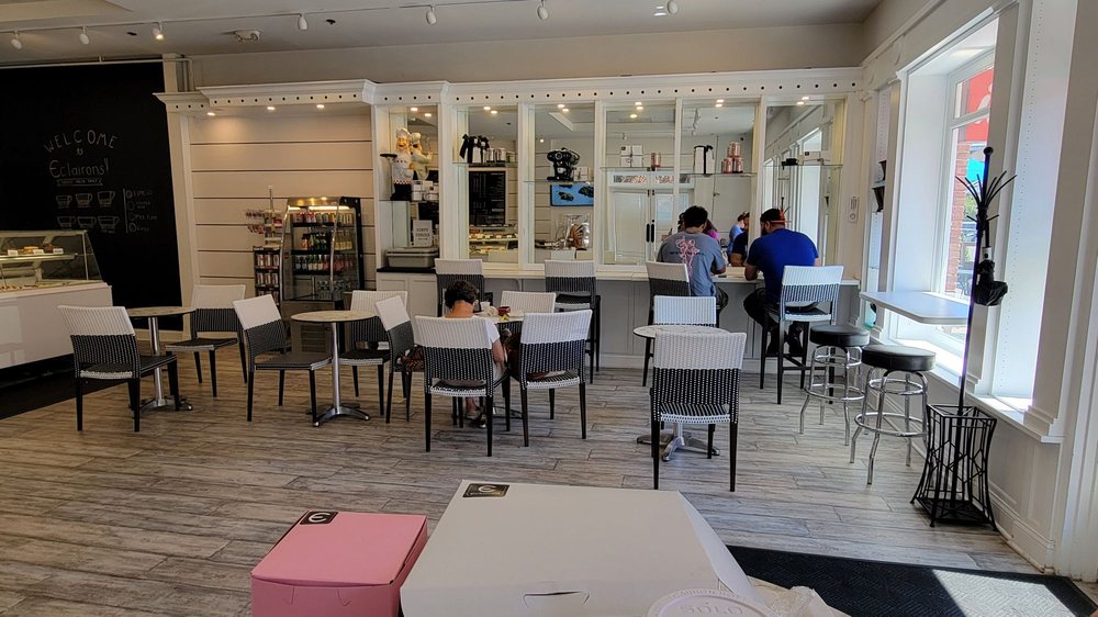 Eclairons - Most of the tables are in that area. There is a refrigerated case with beverages on the left. - interior - Desserts Near Me - Arlington, Virginia Eclairons - Most of the tables are in that area. There is a refrigerated case with beverages on the left. - interior - Desserts Near Me - Arlington, Virginia