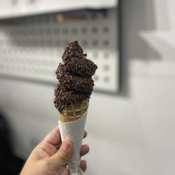 Soft Serve Society - Charcoal coconut ice cream cone with chocolate sprinkles