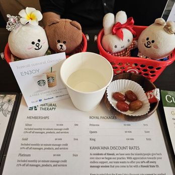 Hawaii Natural Therapy - Starbucks offer, cup of water, grapes, and chocolate... and pricing - Massage Near Me - Honolulu, Hawaii